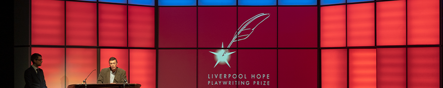 man presenting Playwriting prize awards on stage